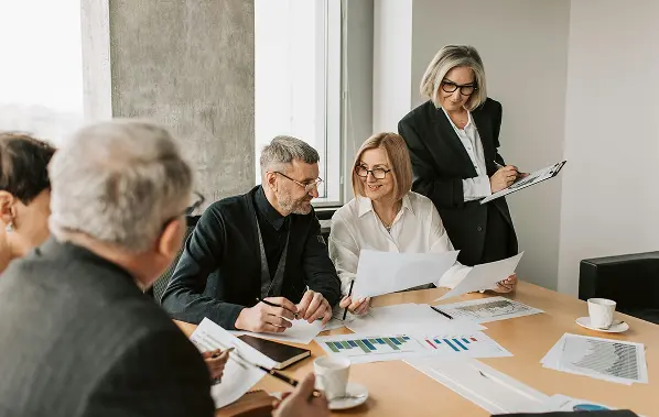 happy older workers with good employee benefits